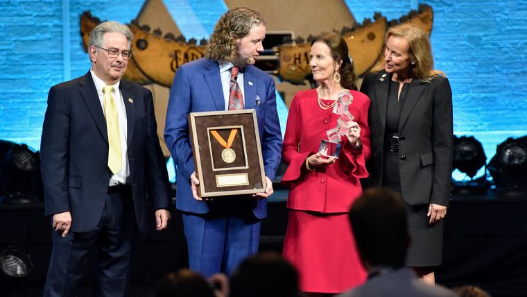 Dr. Mark Lyons (second from left), president of Alltech, and Mrs. Deirdre Lyons (third from left), co-founder and director of corporate image and design at Alltech, accept the Alltech Medal of Excellence and the Alltech Humanitarian Award on behalf of Alltech’s founder, Dr. Pearse Lyons.