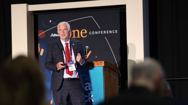 John Sweetman speaking on the Aqua Track stage at the 2022 Alltech ONE Conference